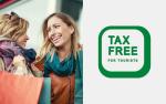 baner z nazwą TAX FREE, dwie uśmiechnięte kobiety
